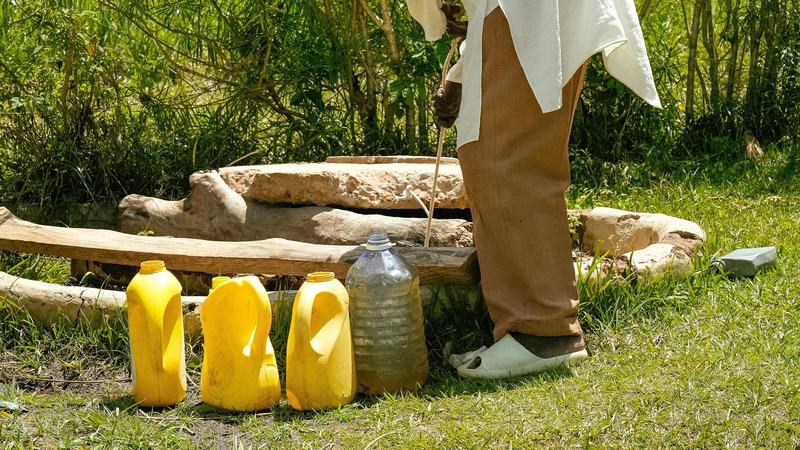 Sample containers set out on grass during groundwater field sampling