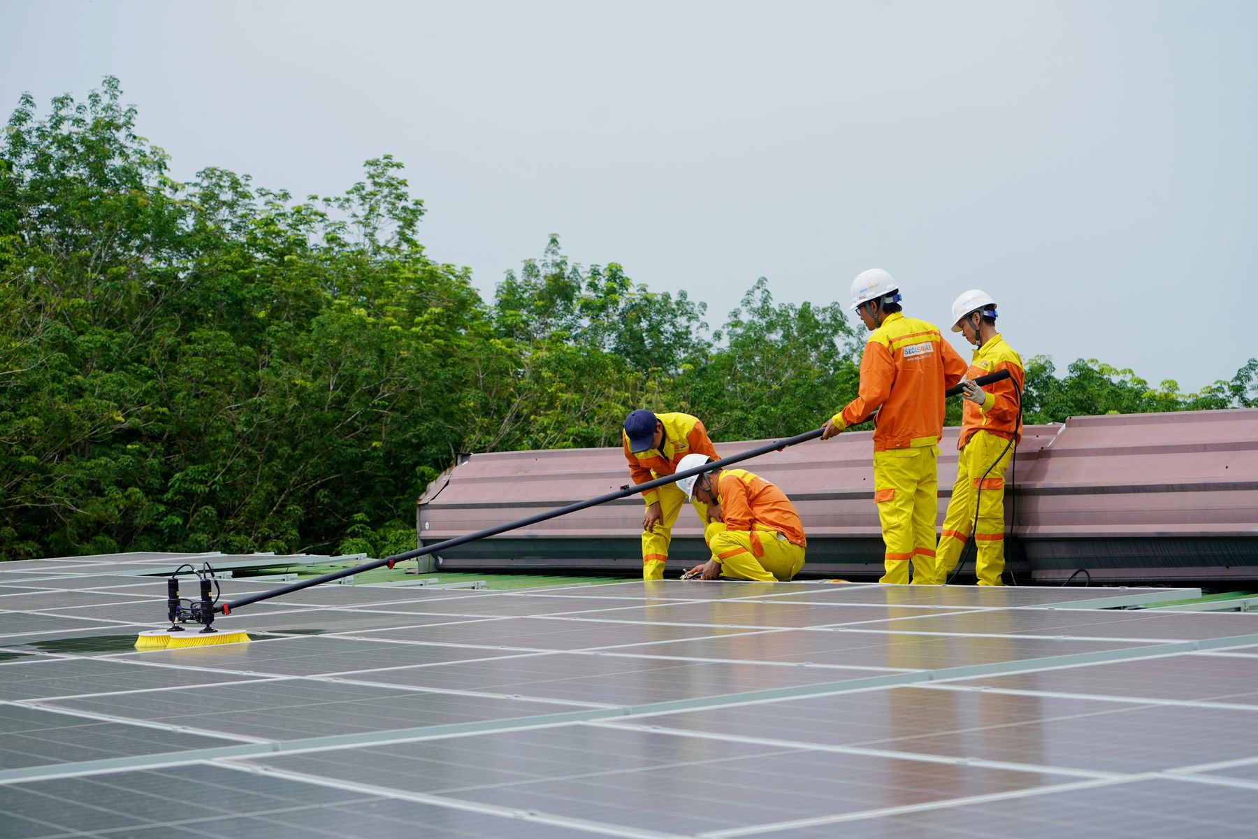 Maintenance inspection of solar panels on a rooftop